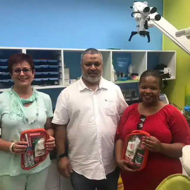 Surgical team with dental supplies in clinic, dental healthcare professionals, South Africa.