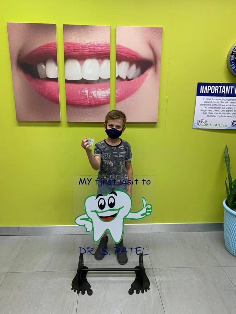 Tooth-friendly welcome for young patient at Dr. S. Patel dental clinic.