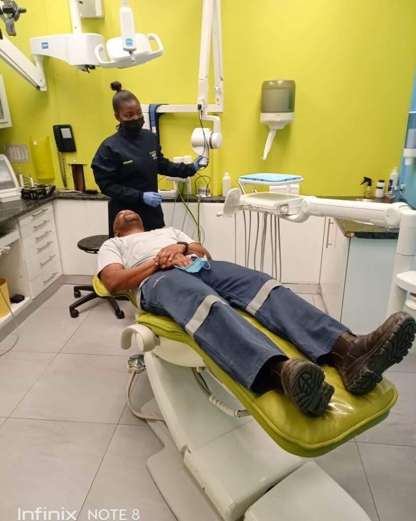 Dental patient receiving treatment in a modern dental clinic.
