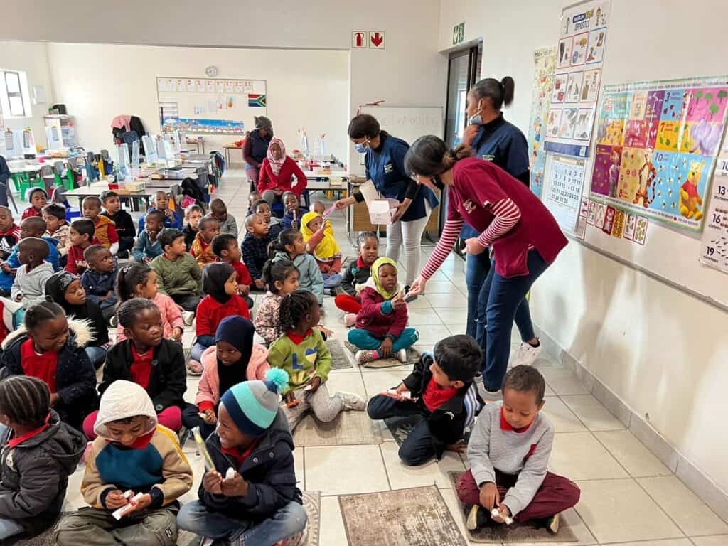Smiling children receiving oral health education at school, South Africa, children’s dental awareness and education, DrSPateldentist local dental care.